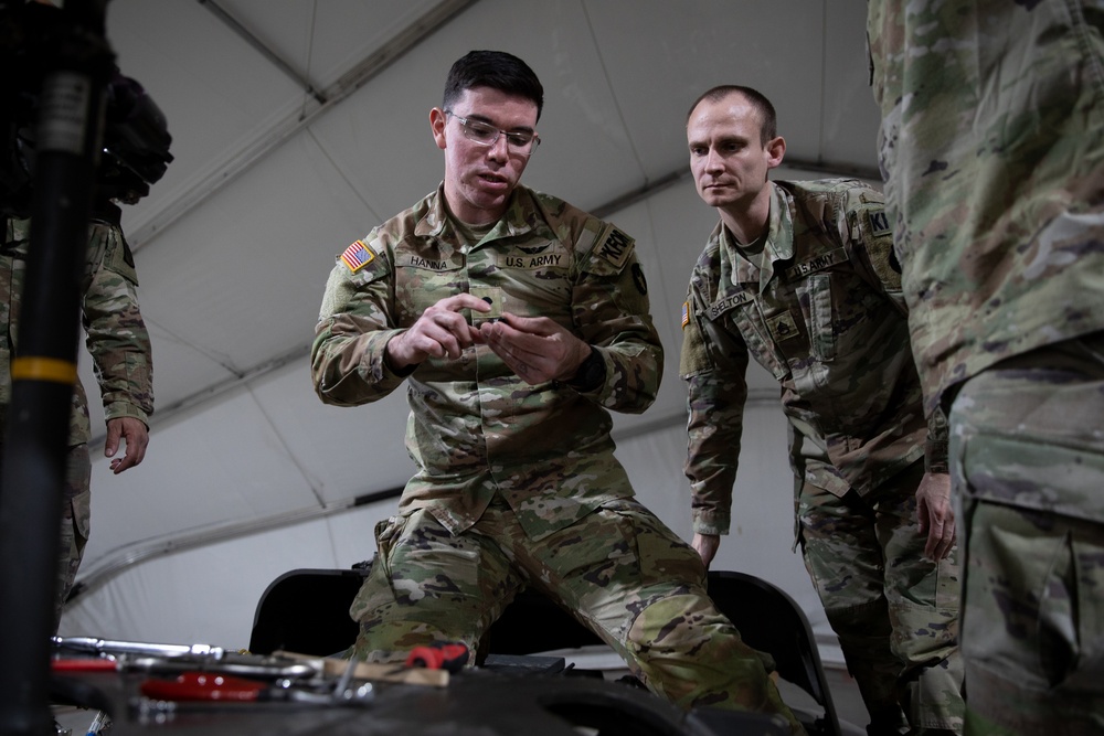 KFOR's Task Force Aviation perform repairs on UH-60M Black Hawk Helicopter