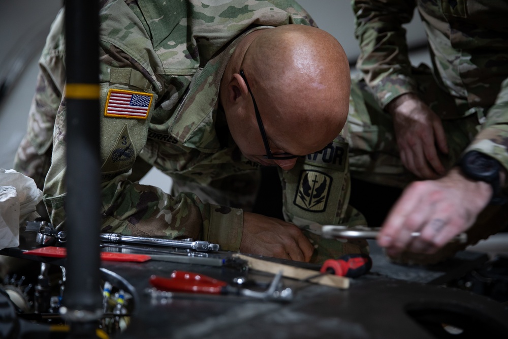 KFOR's Task Force Aviation perform repairs on UH-60M Black Hawk Helicopter