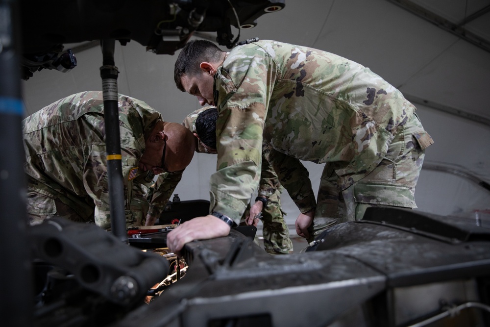 KFOR's Task Force Aviation perform repairs on UH-60M Black Hawk Helicopter