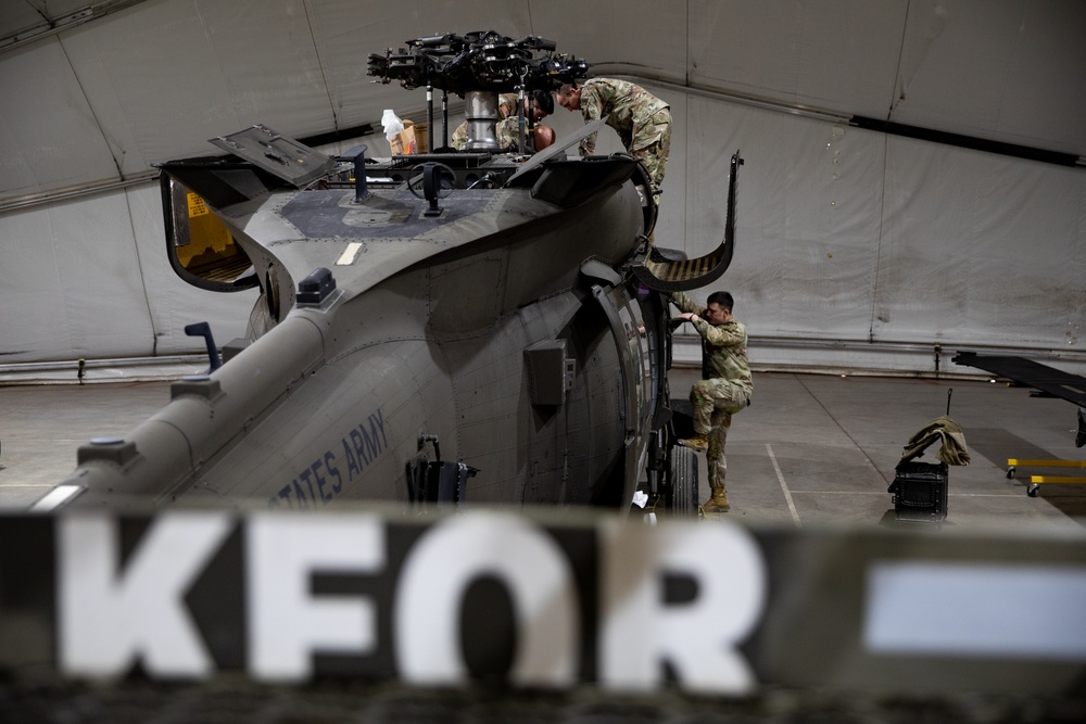 KFOR's Task Force Aviation perform repairs on UH-60M Black Hawk Helicopter