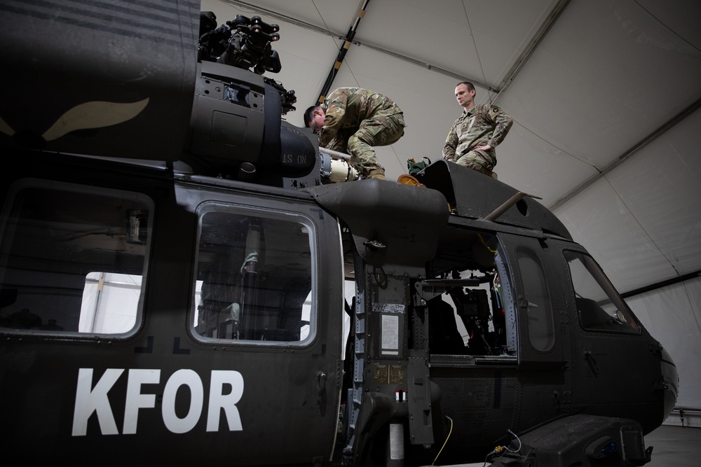 KFOR's Task Force Aviation perform repairs on UH-60M Black Hawk Helicopter