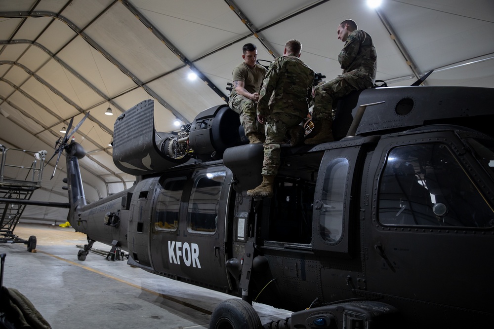 KFOR's Task Force Aviation perform repairs on UH-60M Black Hawk Helicopter