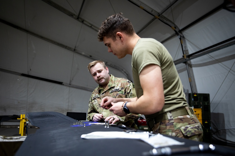 KFOR's Task Force Aviation perform repairs on UH-60M Black Hawk Helicopter