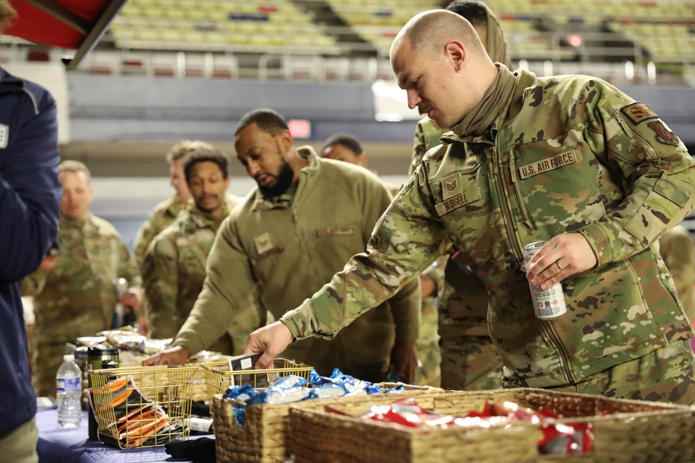 Airmen Receive Snacks During JRSOI for Presidential Inauguration