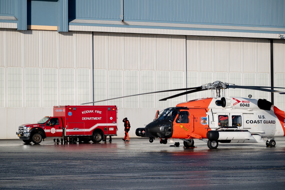 Coast Guard helicopter crew rescues two survivors from capsized vessel