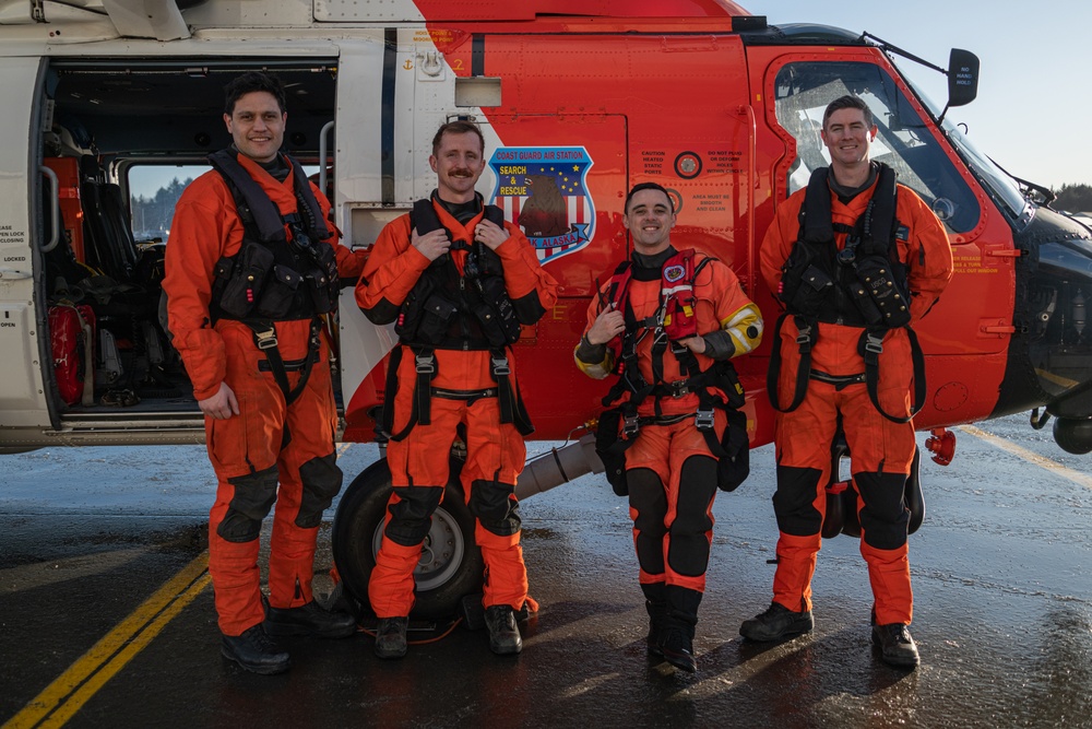 Coast Guard helicopter crew rescues two survivors from capsized vessel