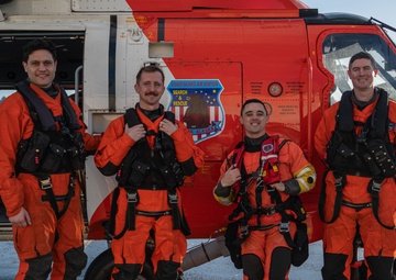 Coast Guard helicopter crew rescues two survivors from capsized vessel