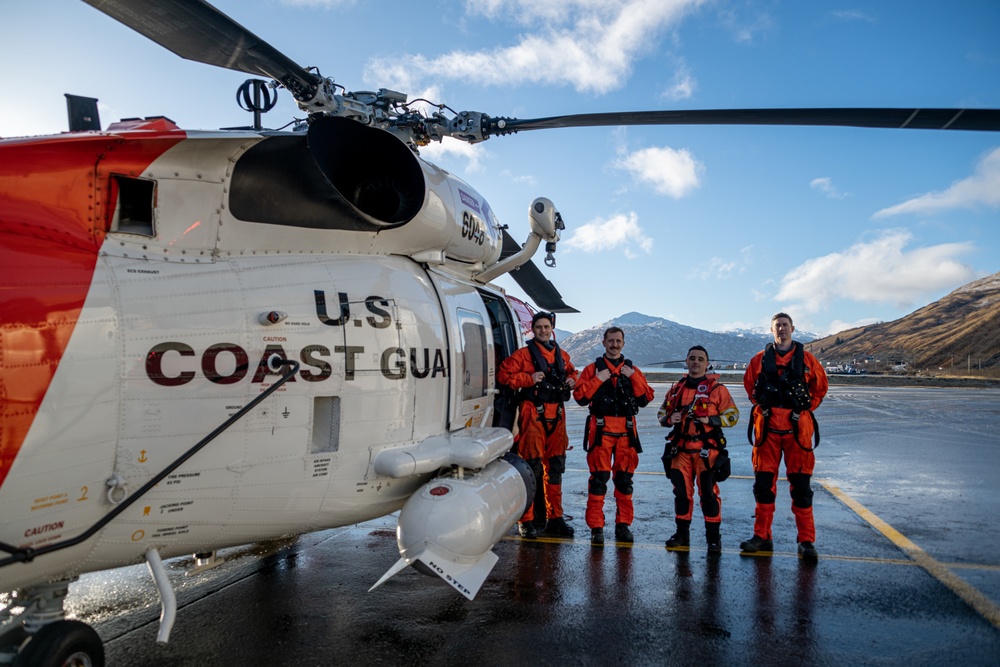 Coast Guard helicopter crew rescues two survivors from capsized vessel