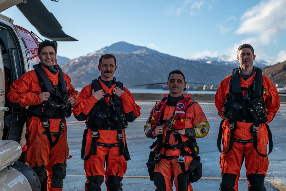 Coast Guard helicopter crew rescues two survivors from capsized vessel