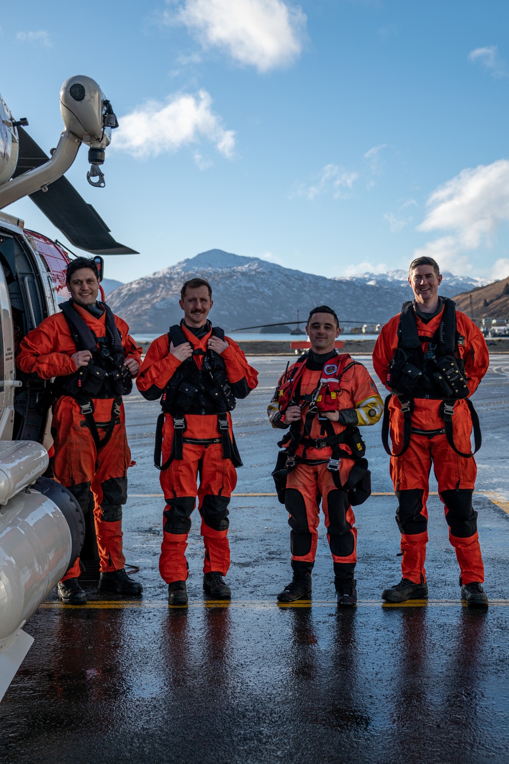 Coast Guard helicopter crew rescues two survivors from capsized vessel