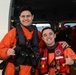 Coast Guard helicopter crew rescues two survivors from capsized vessel