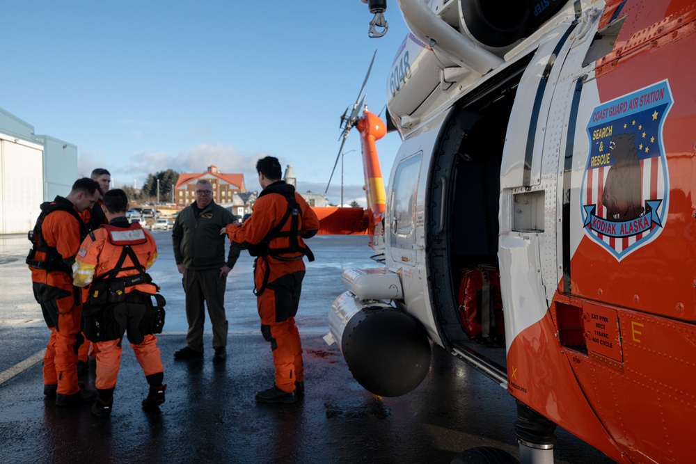 Coast Guard helicopter crew rescues two survivors from capsized vessel