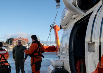 Coast Guard helicopter crew rescues two survivors from capsized vessel