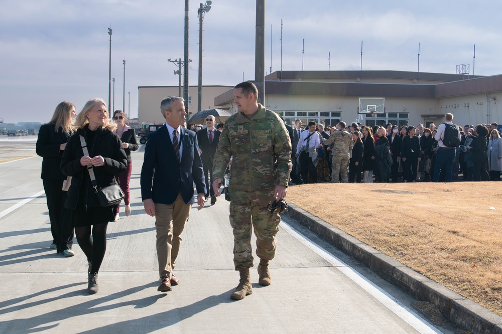 DFAS personnel walk the flightline