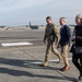 DFAS personnel walk the flightline