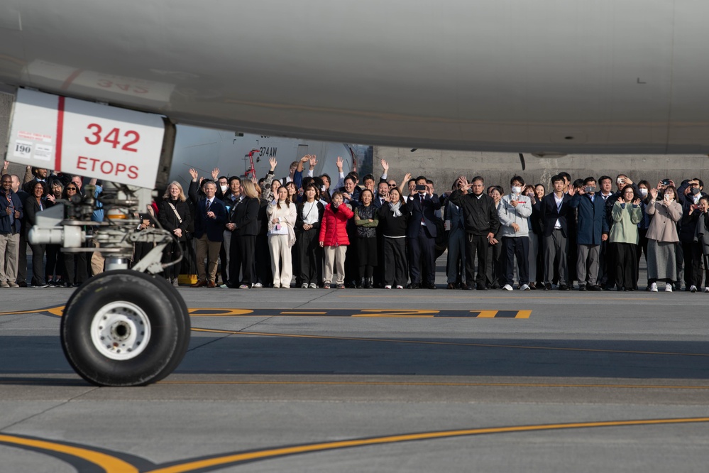 DFAS personnel walk the flightline