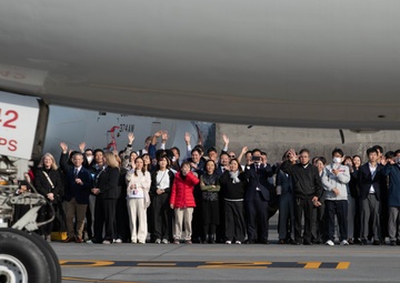 DFAS personnel walk the flightline