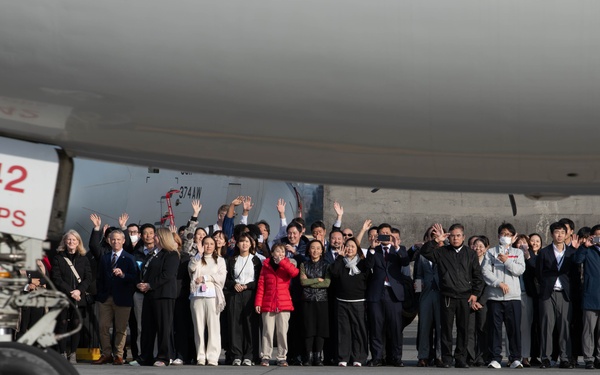 DFAS personnel walk the flightline