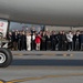 DFAS personnel walk the flightline