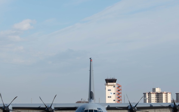 DFAS personnel walk the flightline