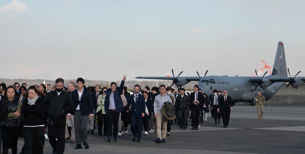 DFAS personnel walk the flightline