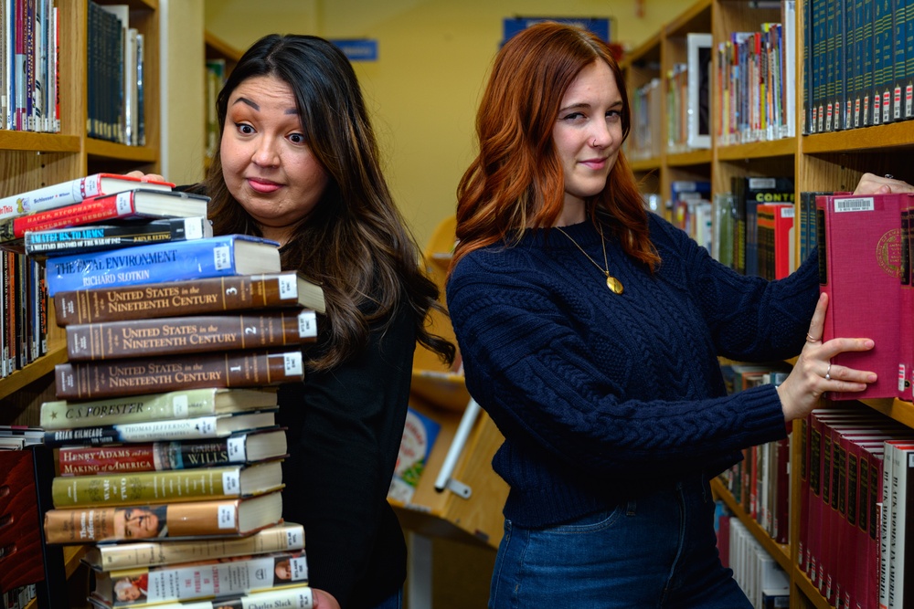 Library staff literally balance the books