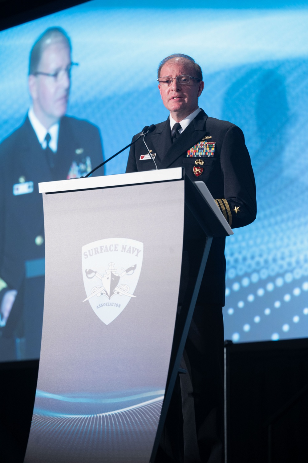 Admiral Stuart Munsch speaks at the SNA 2025