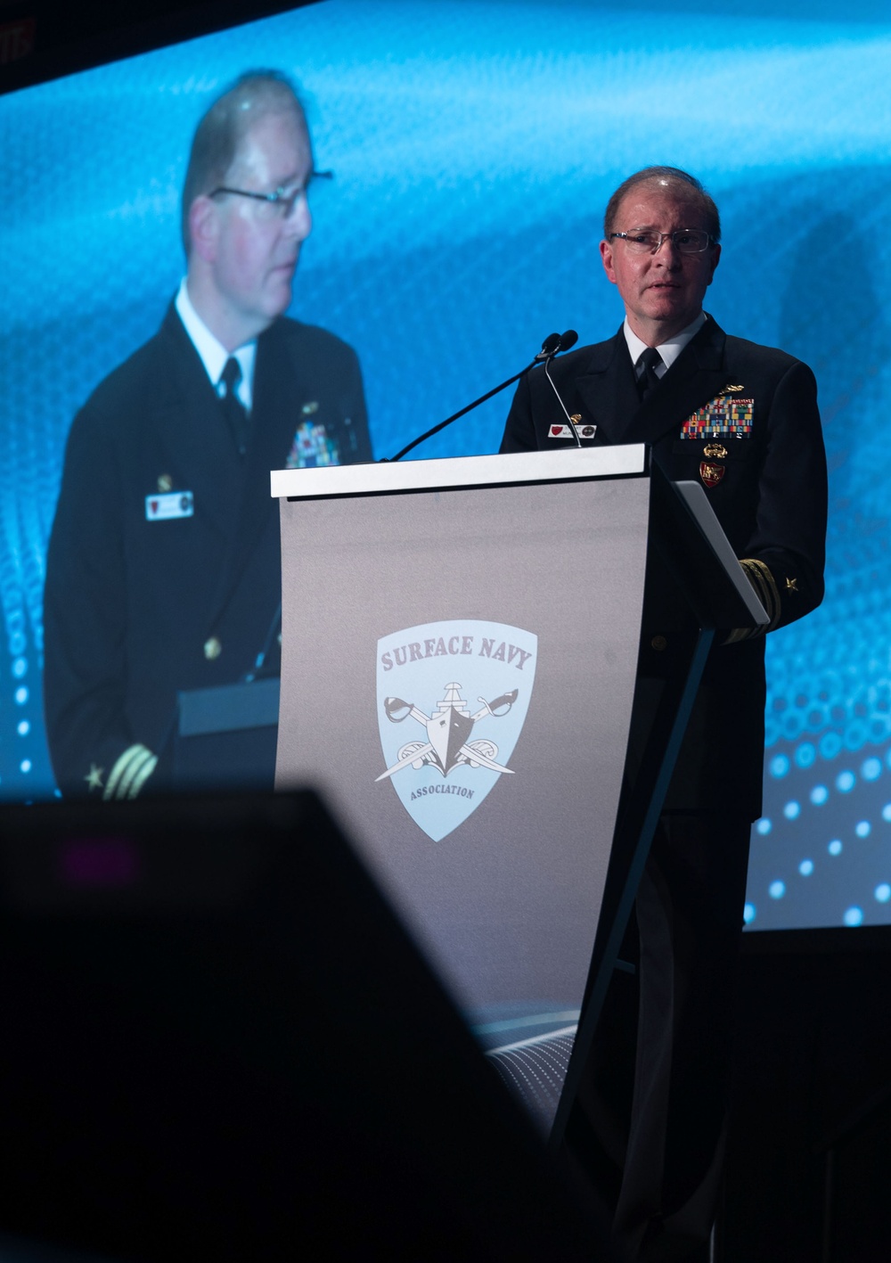 Admiral Munsch speaks at the SNA 2025