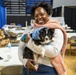 Soldier and Family Readiness Specialist Hawa Bangura Poses with her Emotional Support Dog While Supporting 60th Presidential Inauguration