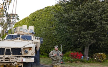 330th and 670th Military Police Companies stand watch as the sun sets in LA