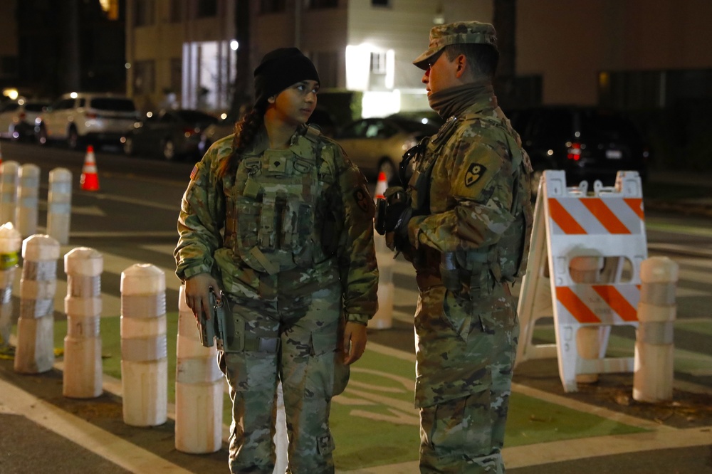 330th and 670th Military Police Companies Maintain Security Near the LA Wildfires As The Sun Sets