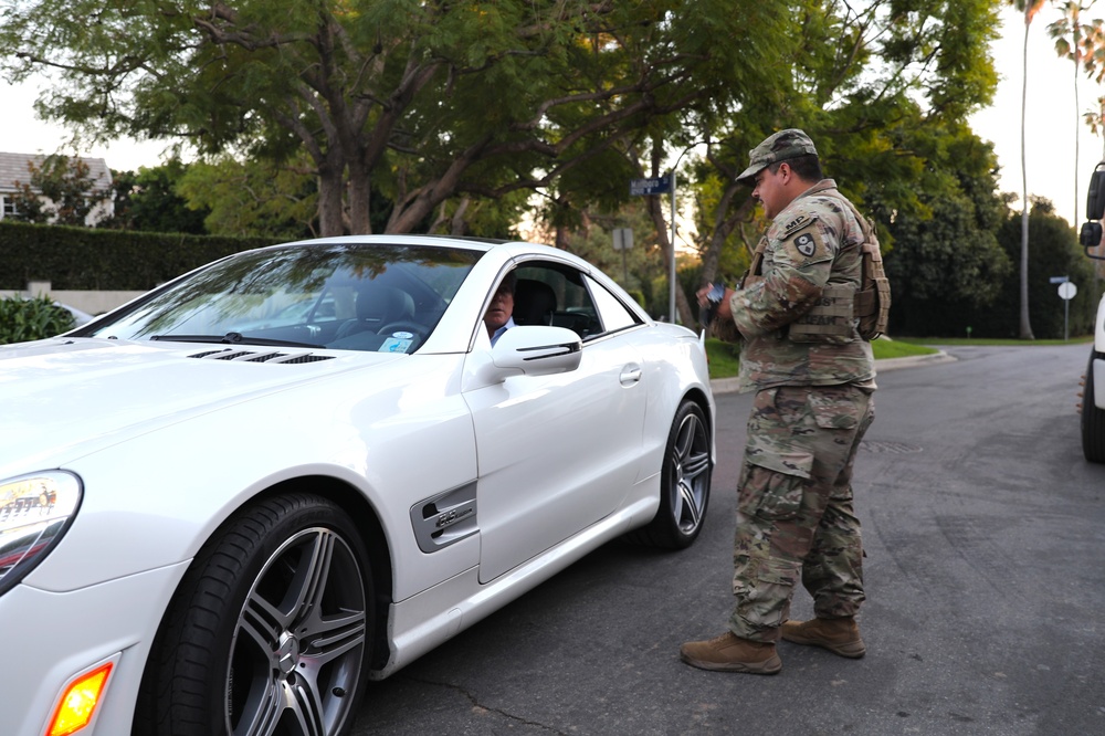 330th and 670th Military Police Companies Maintain Security Near the LA Wildfires As The Sun Sets