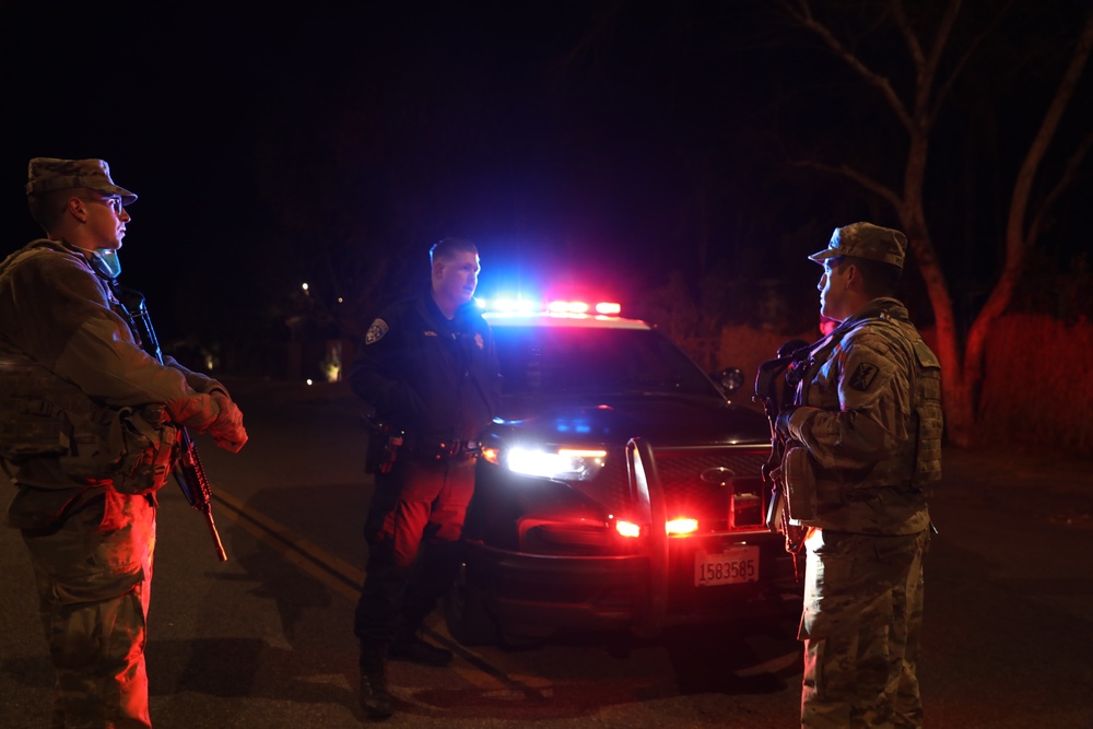 1st Battalion, 143rd Field Artillery Regiment Soldiers guard TCPs with local law enforcement