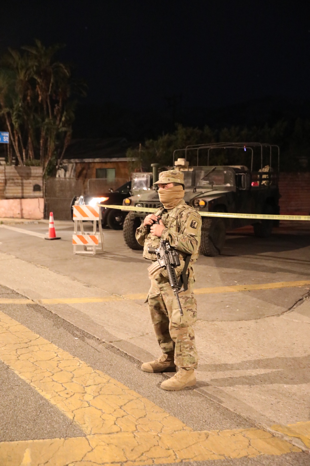 1st Battalion, 143rd Field Artillery Regiment Soldiers guard TCPs with local law enforcement