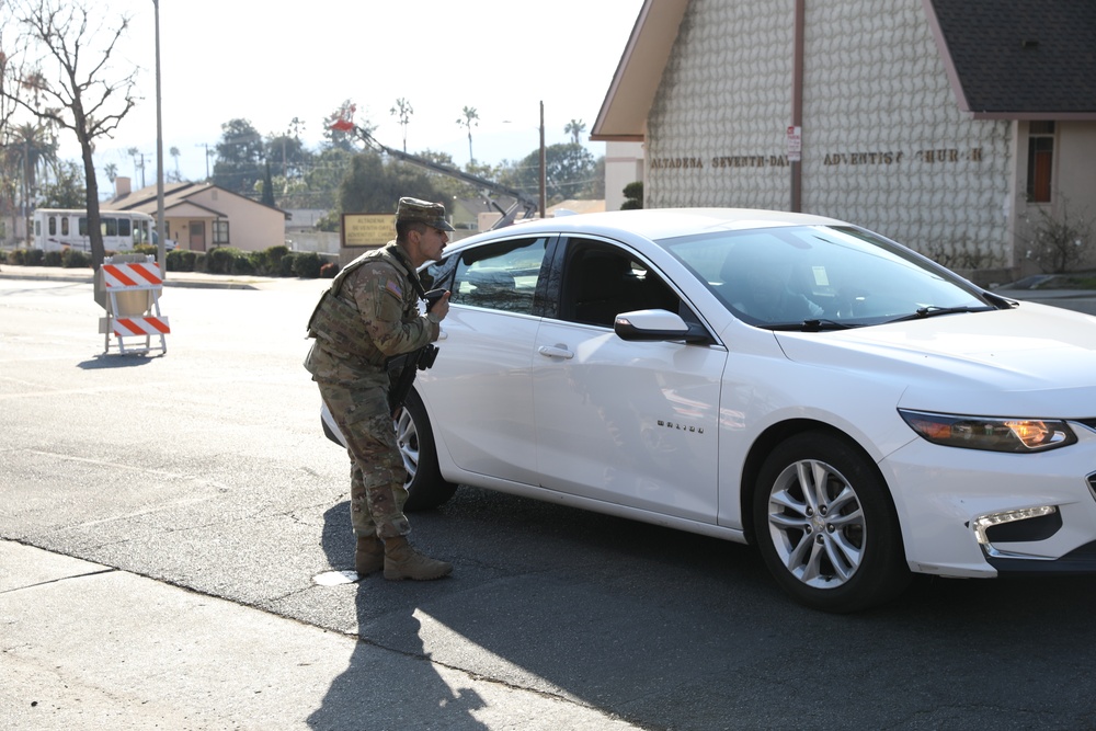 1st Battalion,143rd Field Artillery Regiment Soldiers guard TCPs with local law enforcement