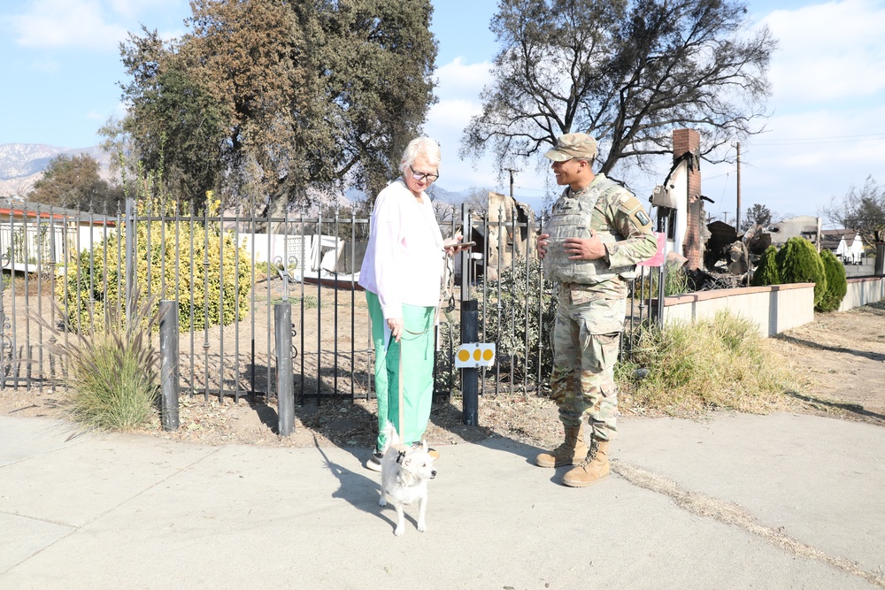 1st Battalion, 143rd Field Artillery Regiment Soldiers guard TCPs with local law enforcement