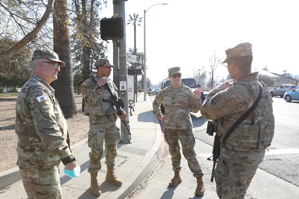 1st Battalion, 143th Field Artillery Regiment Soldiers guard Traffic Control Points with local law enforcement