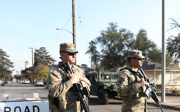 1st Battalion, 143rd Field Artillery Regiment Soldiers guard TCPs with local law enforcement