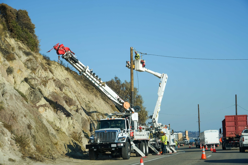 Crews work to restore power in the Palisades after the wildfires