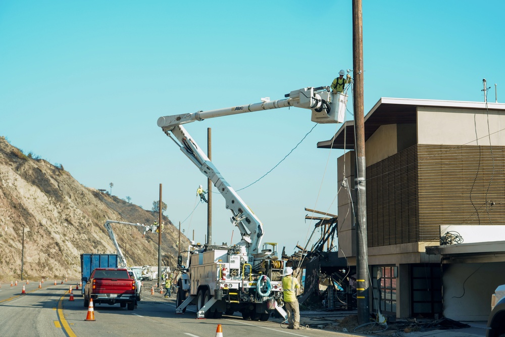 Crews work to restore power in the Palisades after the wildfires