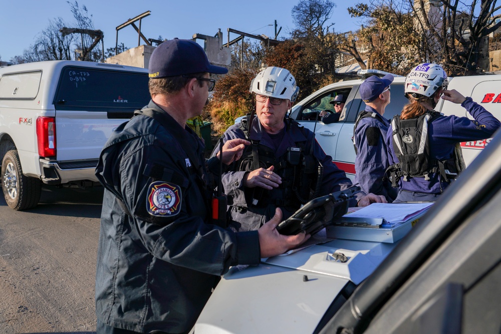 Cal Fire, California Task Force 3 and Ejercito Mexicano Rescate respond to the Palisades wildfire in California.