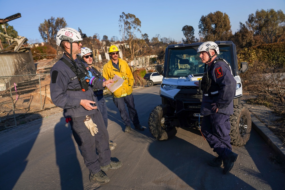 Cal Fire, California Task Force 3 and Ejercito Mexicano Rescate respond to the Palisades wildfire in California.