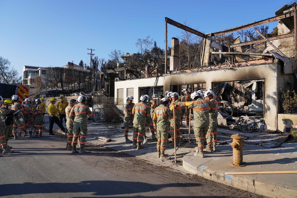 Cal Fire, California Task Force 3 and Ejercito Mexicano Rescate respond to the Palisades wildfire in California.