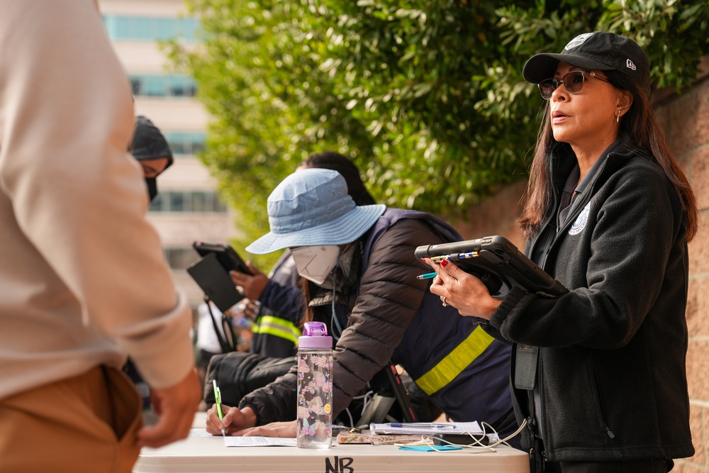 FEMA Disaster Survivor Assistance team and volunteers assist wildfire survivors at the Run with Us community event in Pasadena, California