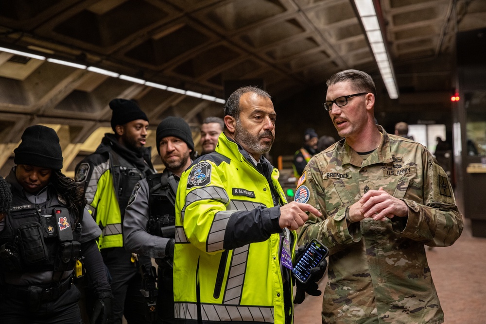 New York National Guard Soldier speaks with Washington D.C. Metro Transit Police Officer