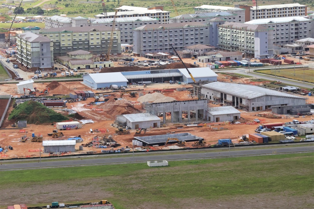 Marine Corps Base Camp Blaz Construction Photos Show Newly Erected Building Envelopes in the Foreground and In-Progress Bachelor Enlisted Quarters in the Background