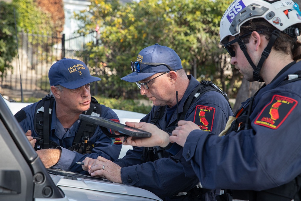 Search and Rescue teams perform search mission in Pacific Palisades