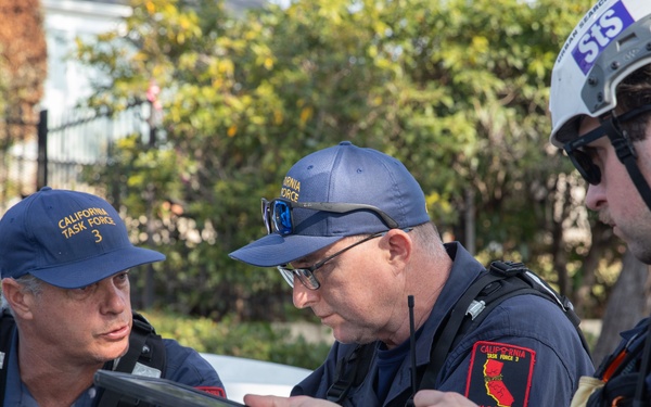 Search and Rescue teams perform search mission in Pacific Palisades