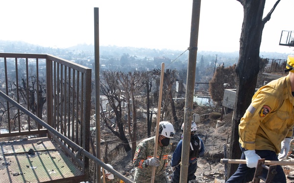 Search and Rescue teams perform search mission in Pacific Palisades