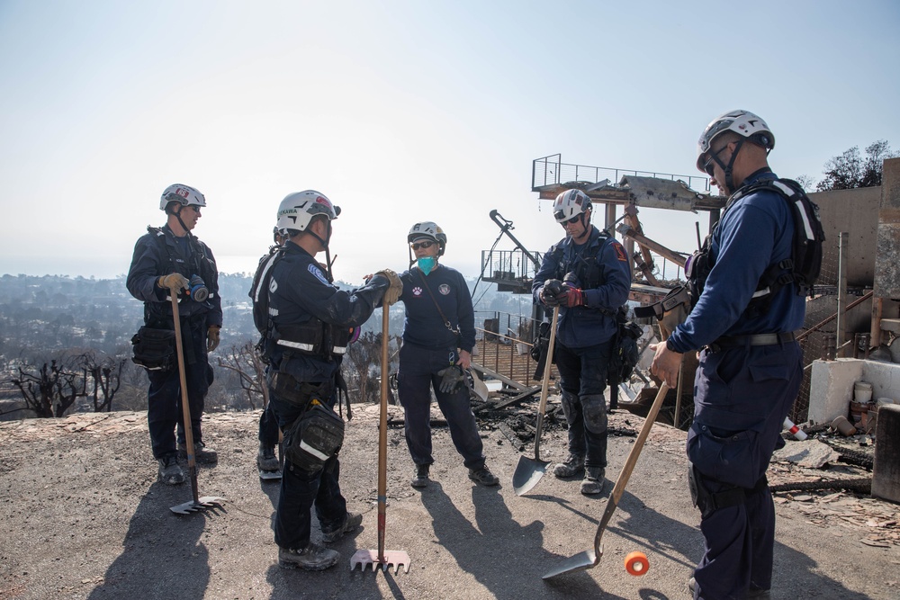 Search and Rescue teams perform search mission in Pacific Palisades